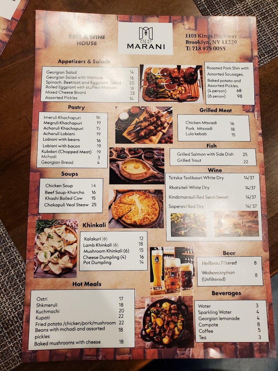 Printed menu featuring kebabs, salads, and khachapuri.